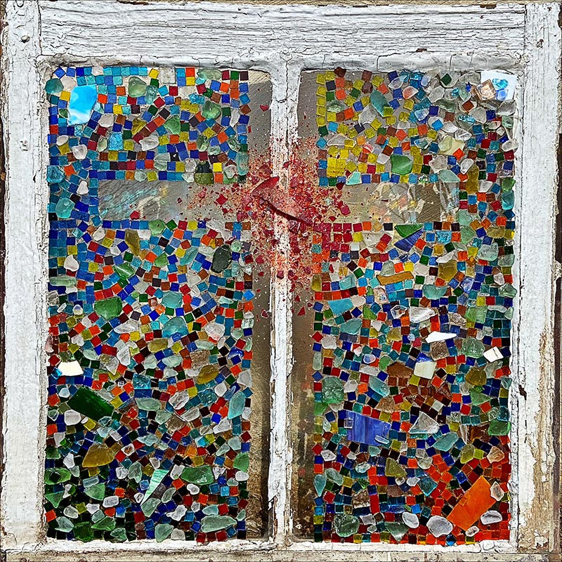 station 6 represented with multi-colored shards of glass outlining the shape of a cross